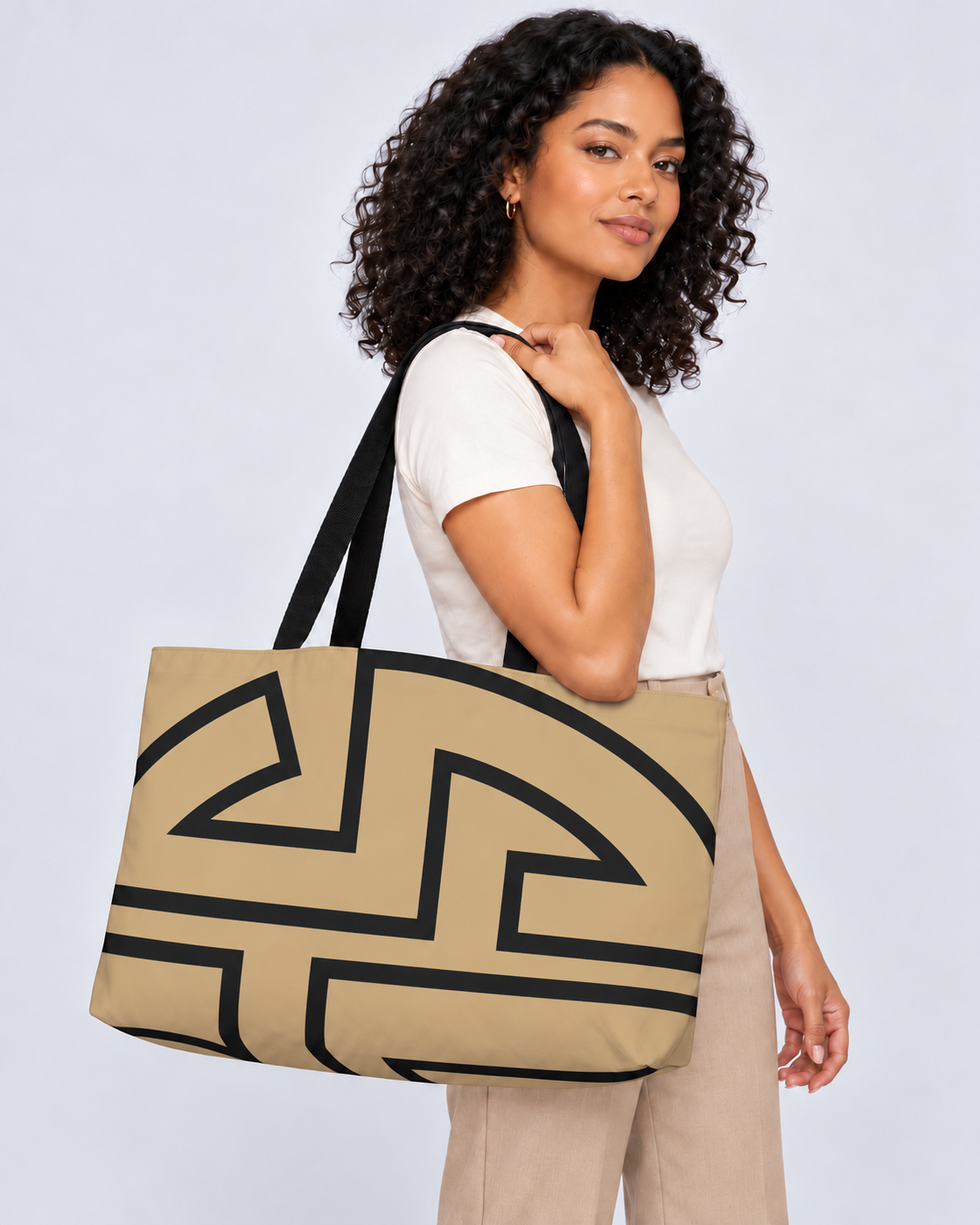 Model carrying the Bold Monogram weekender tote