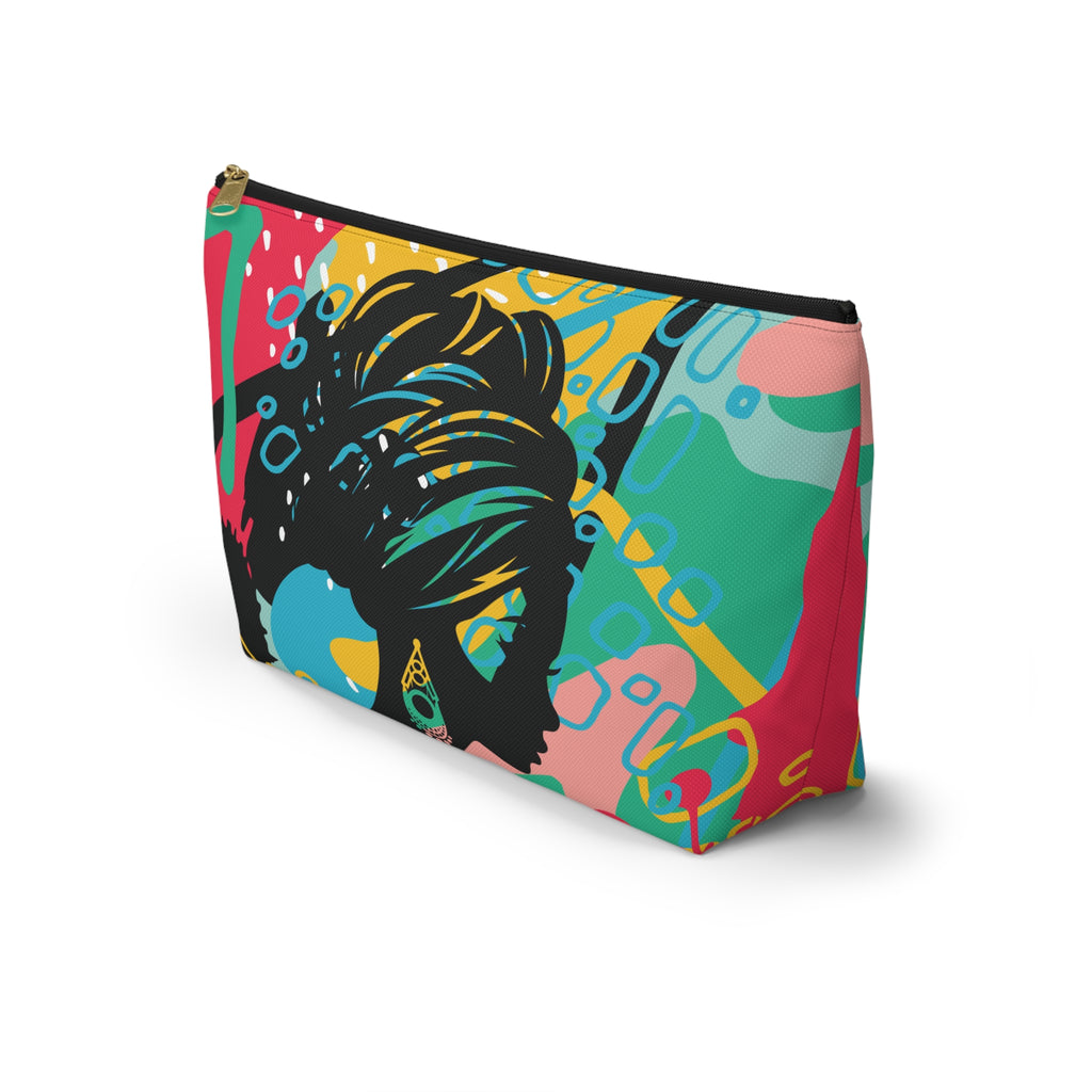 A rectangular zippered pouch with a colorful abstract print featuring a black silhouette of a woman.