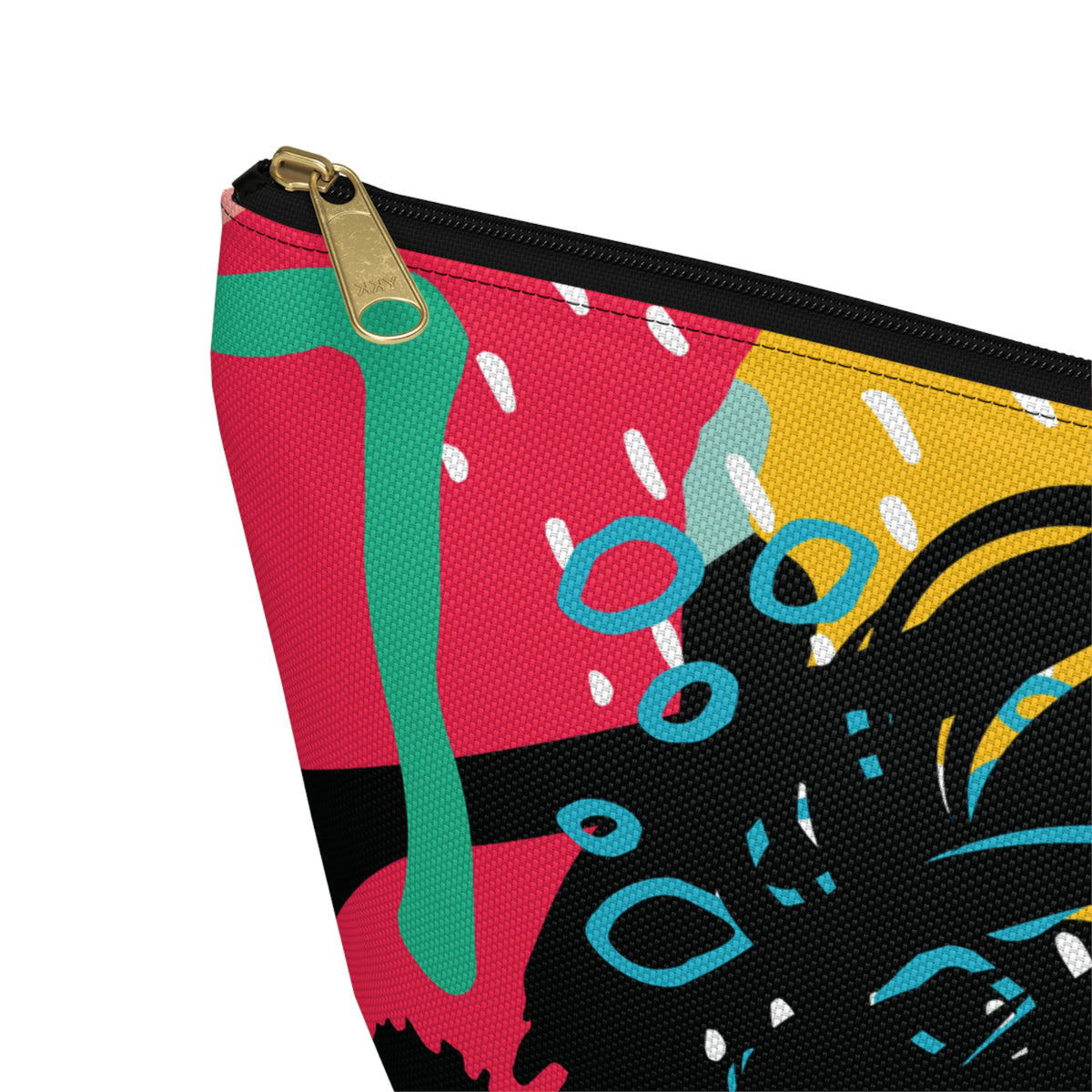 A close-up of a zippered pouch with a colorful abstract print featuring pink, yellow, black, teal, and green shapes, shown on a white background.