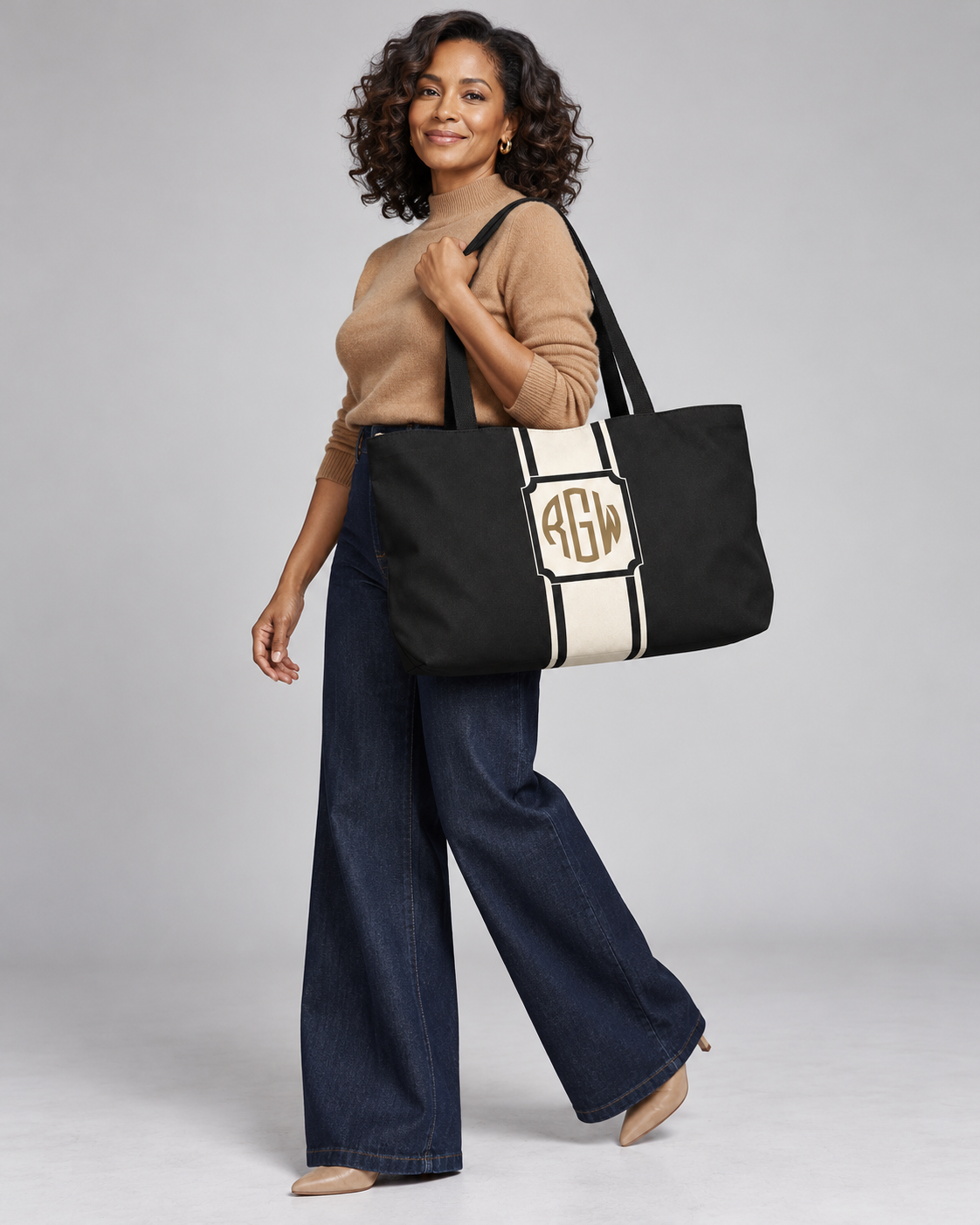 Model carrying the Bold Personalized Monogram weekender tote in Natural and Black